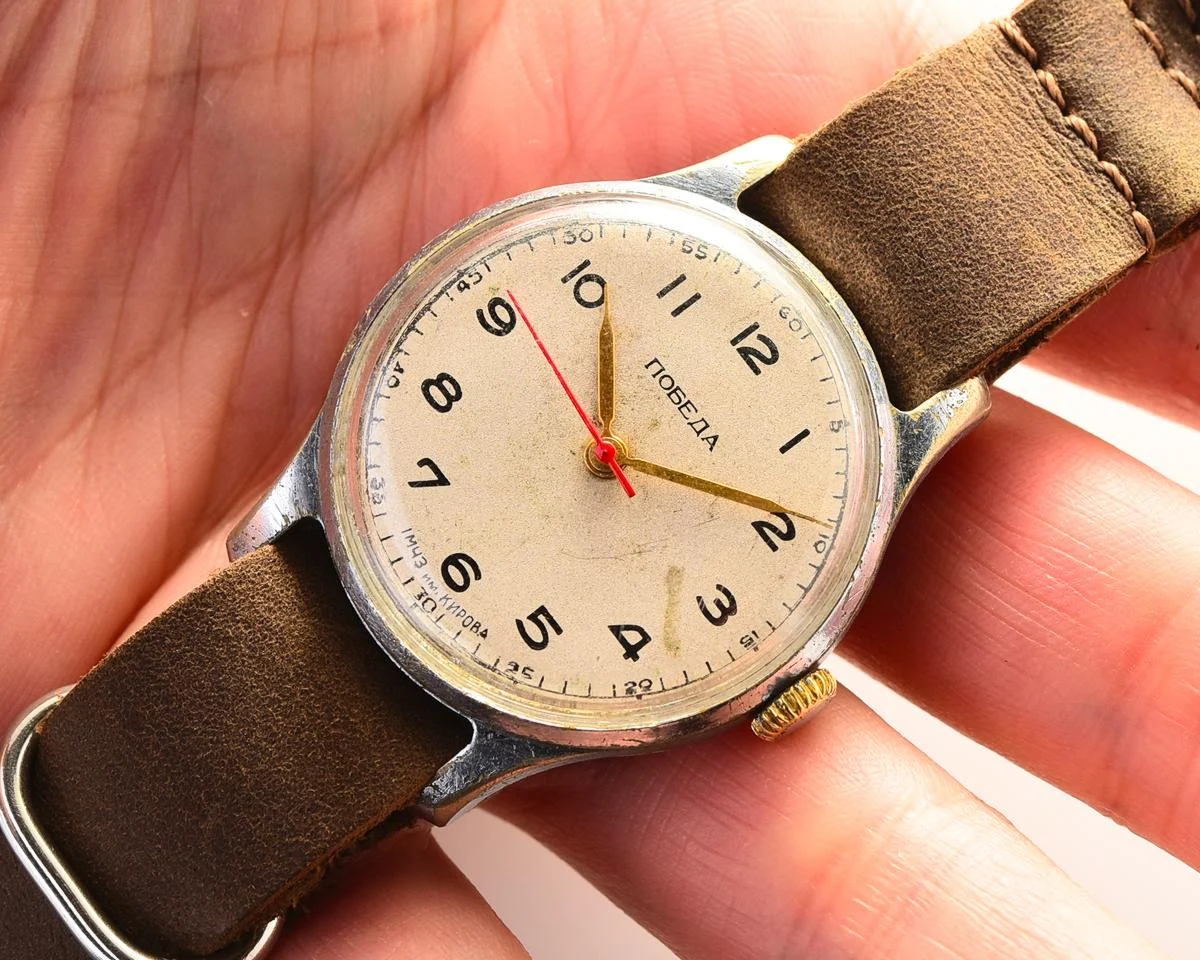 Vintage Soviet mechanical Pobeda wrist watch with central seconds hand