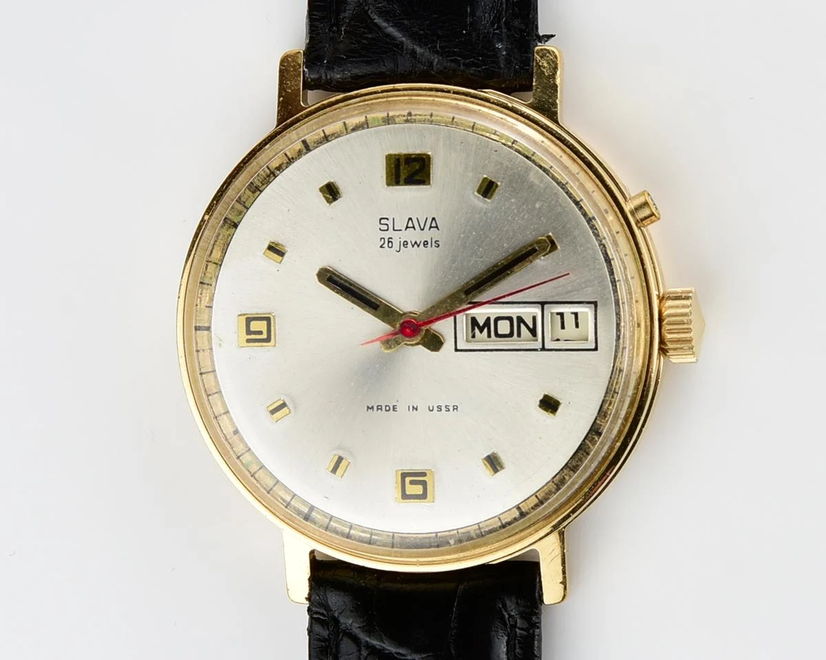 Slava gold-plated vintage Soviet mechanical watch with day/date calendar