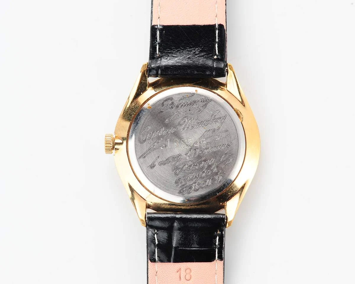 Elegant Raketa Soviet quartz watch with engraved back