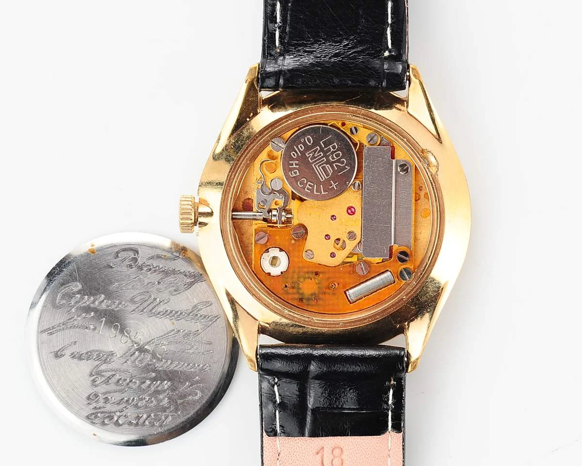 Elegant Raketa Soviet quartz watch with engraved back