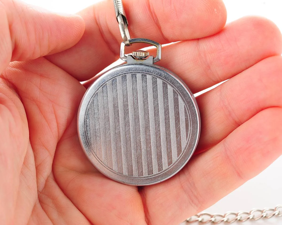 Excellent Molnija open face pocket watch with metallic dial and blue hands