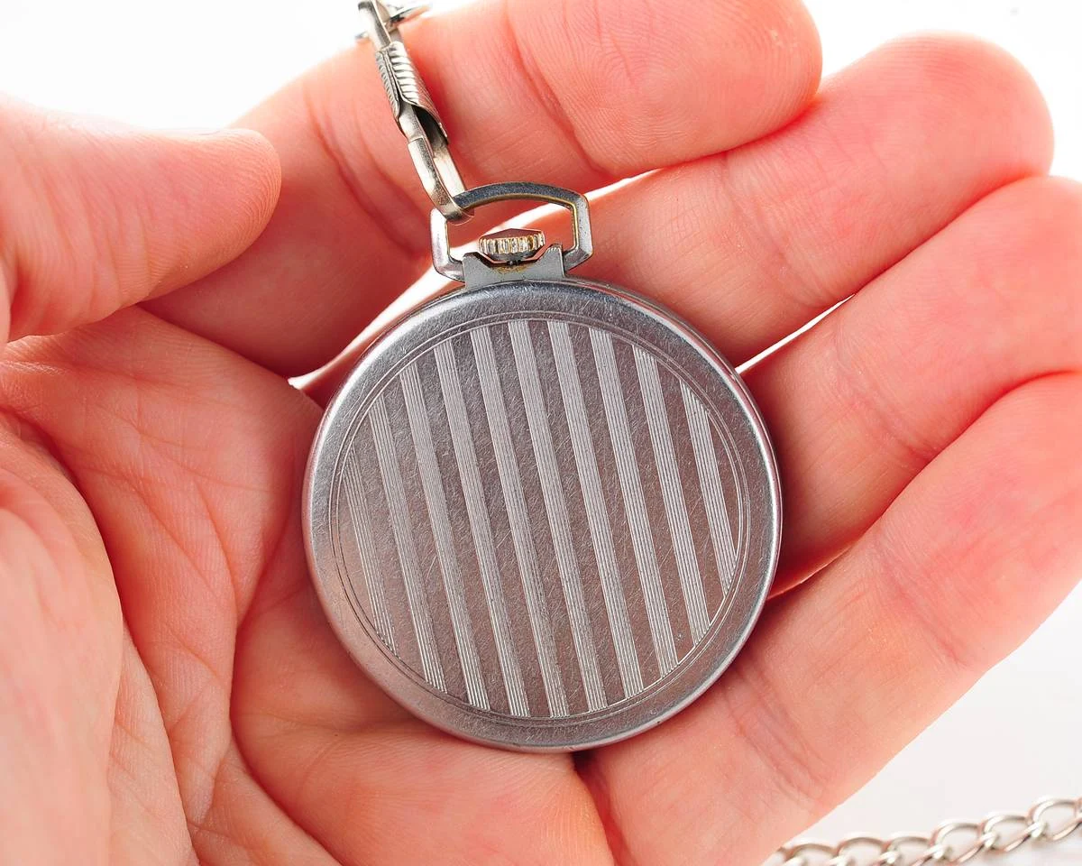 Excellent Molnija open face pocket watch with metallic dial and blue hands