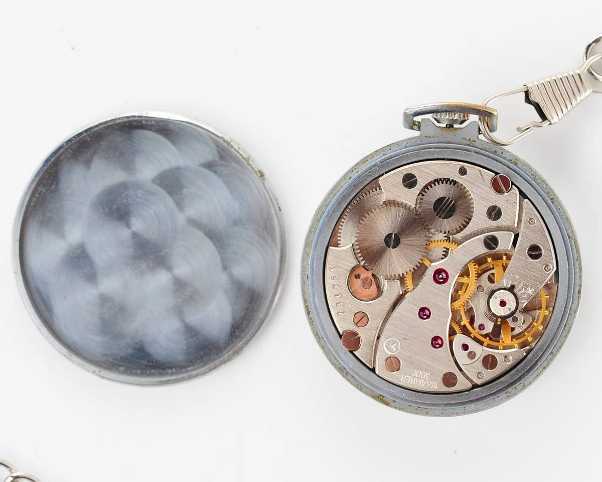 Excellent Molnija open face pocket watch with metallic dial and blue hands