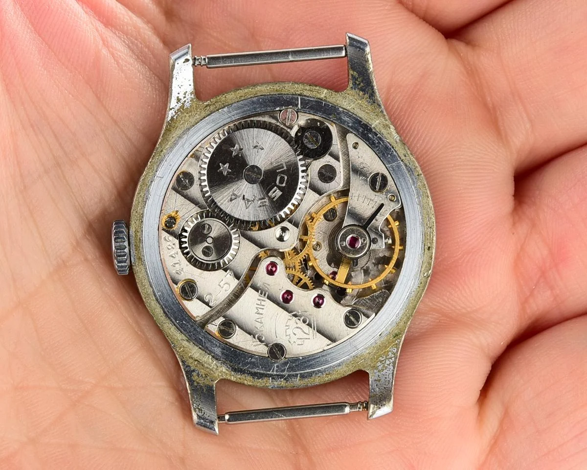 Vintage mechanical Pobeda wrist watch with rubbies on dial