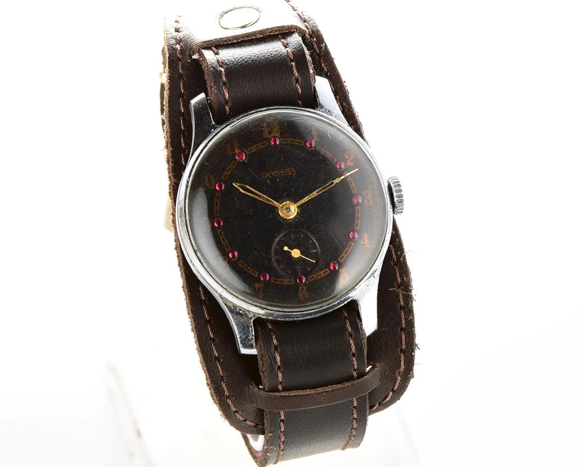 Vintage mechanical Pobeda wrist watch with rubbies on dial