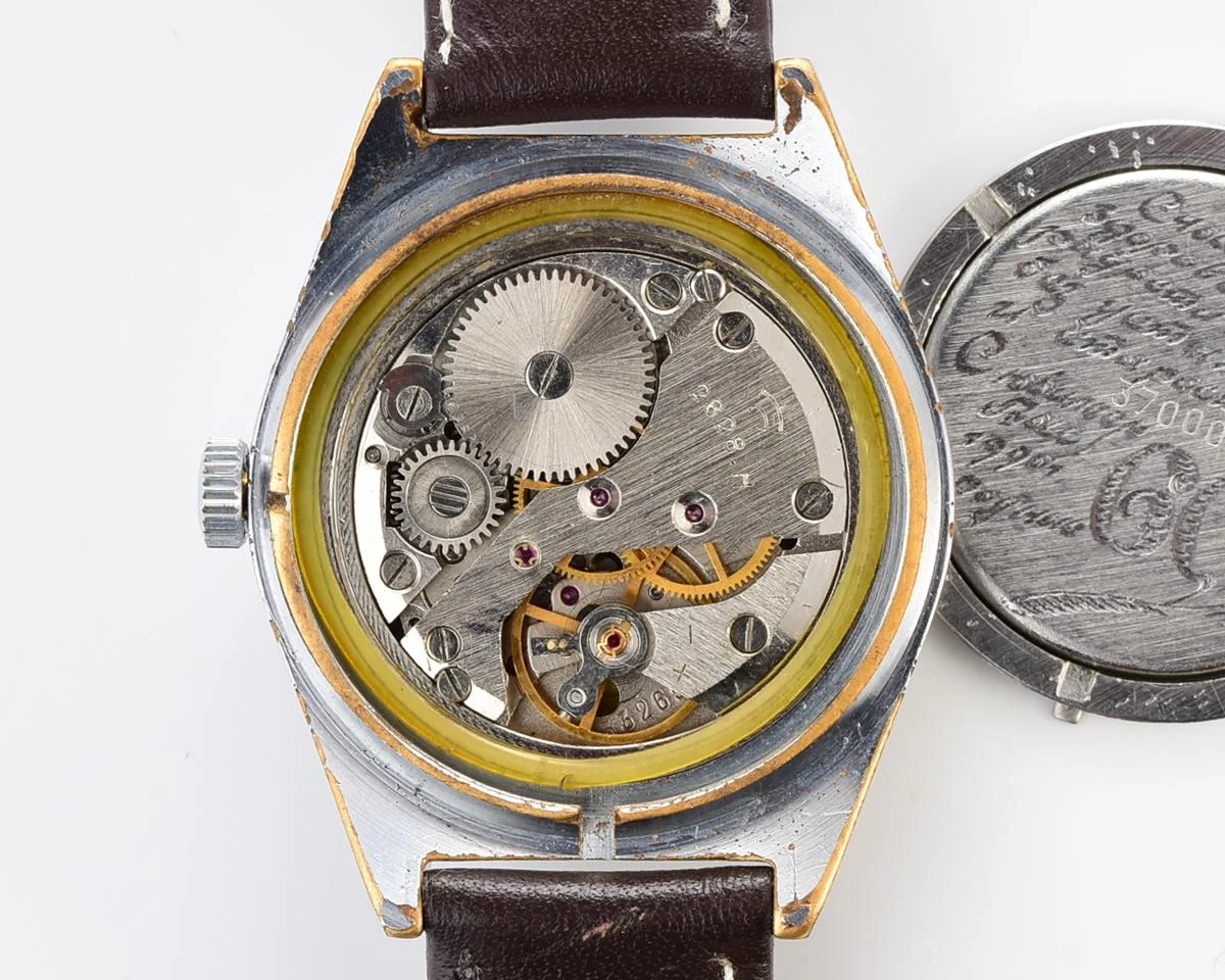 Vintage Soviet mechanical Raketa watch with double calendar with engraved back