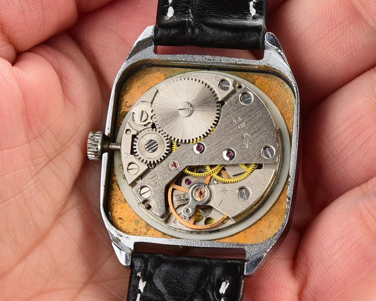 Vintage Soviet Raketa mechanical watch with roman dial and engraved back