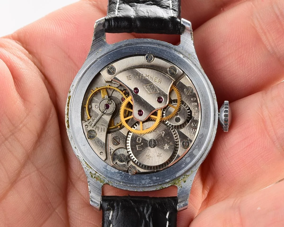 Vintage Pobeda watch with central seconds hand and diamond shaped crown, from 1954!