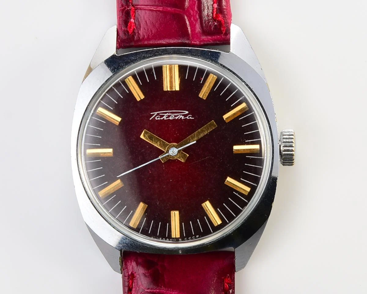Vintage Soviet Raketa mechanical watch with stark crimson dial