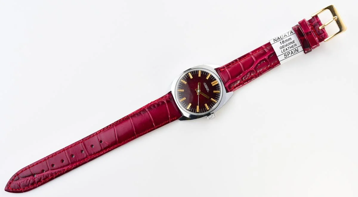 Vintage Soviet Raketa mechanical watch with stark crimson dial