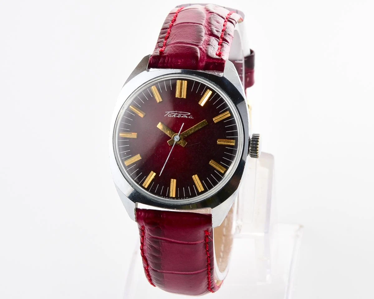 Vintage Soviet Raketa mechanical watch with stark crimson dial