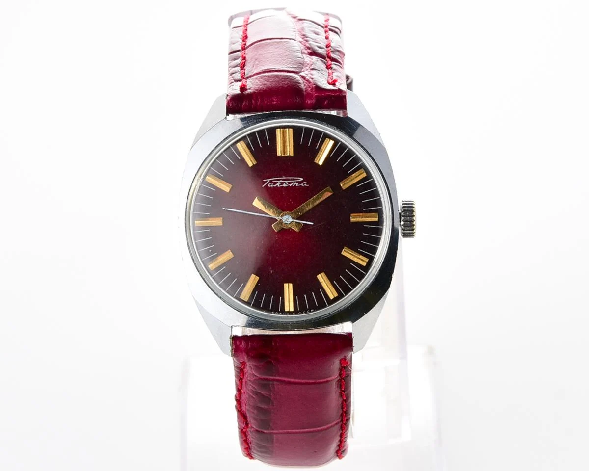 Vintage Soviet Raketa mechanical watch with stark crimson dial