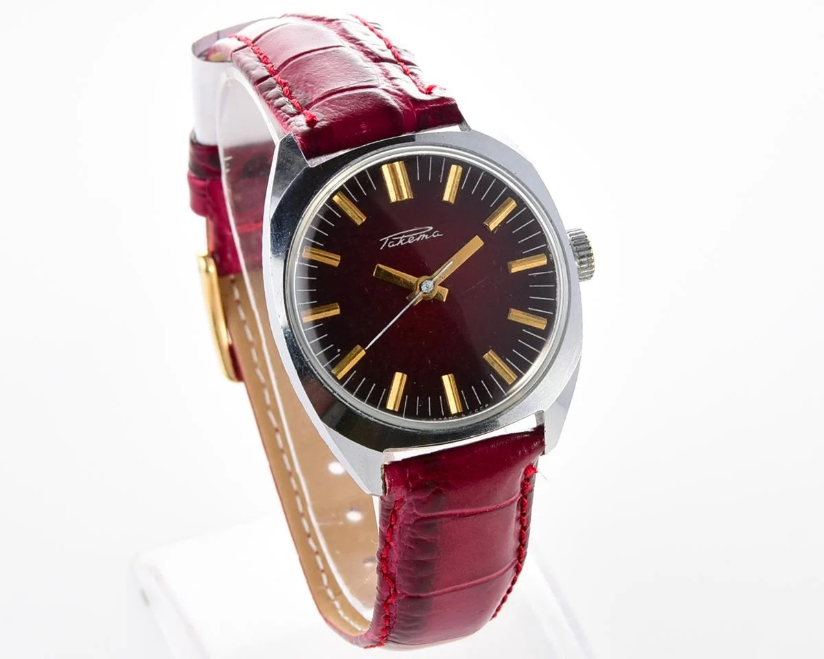 Vintage Soviet Raketa mechanical watch with stark crimson dial