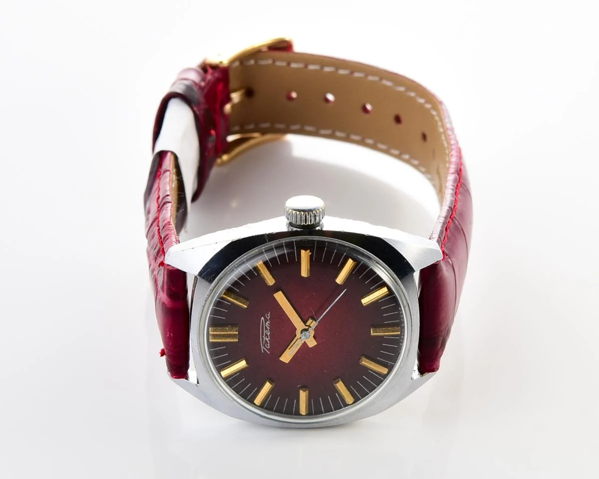Vintage Soviet Raketa mechanical watch with stark crimson dial