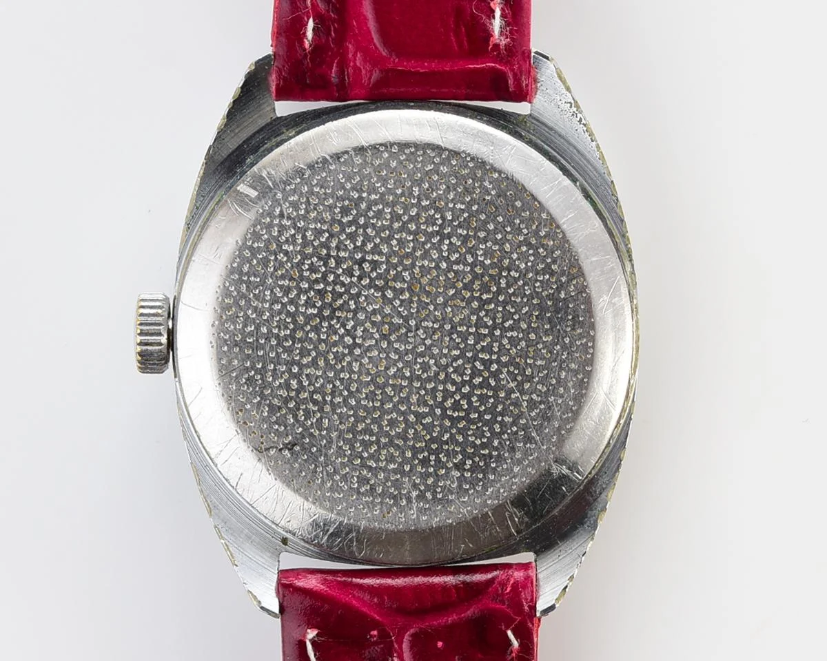 Vintage Soviet Raketa mechanical watch with stark crimson dial