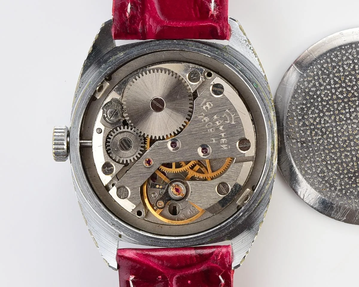 Vintage Soviet Raketa mechanical watch with stark crimson dial