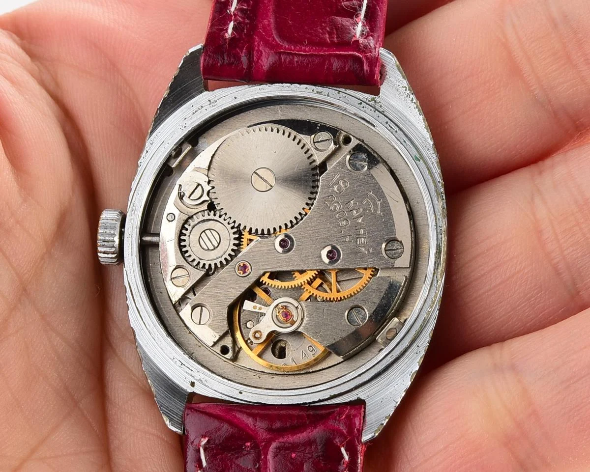 Vintage Soviet Raketa mechanical watch with stark crimson dial