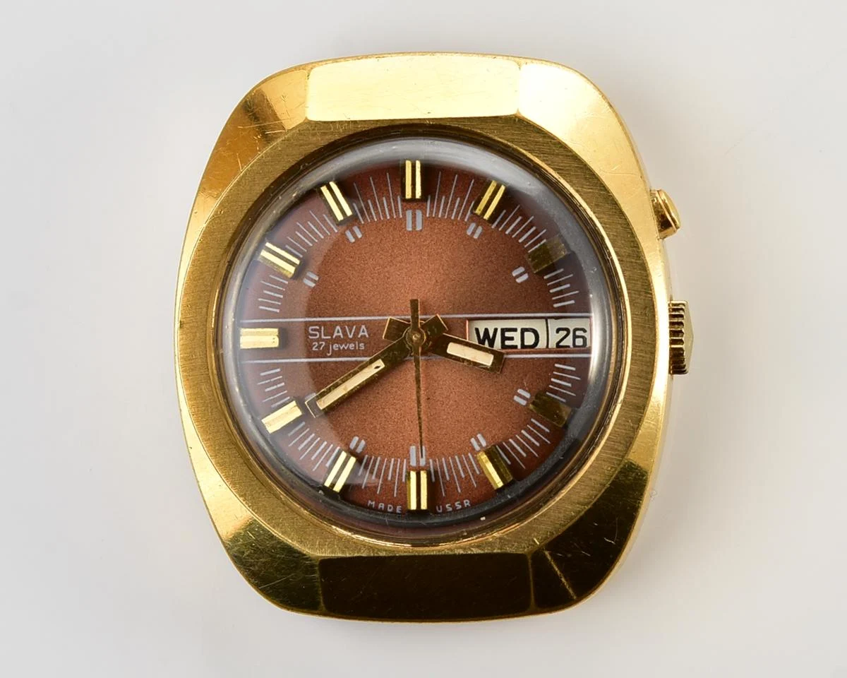 Slava vintage Soviet gold-plated mechanical watch with automatic self-winding movement
