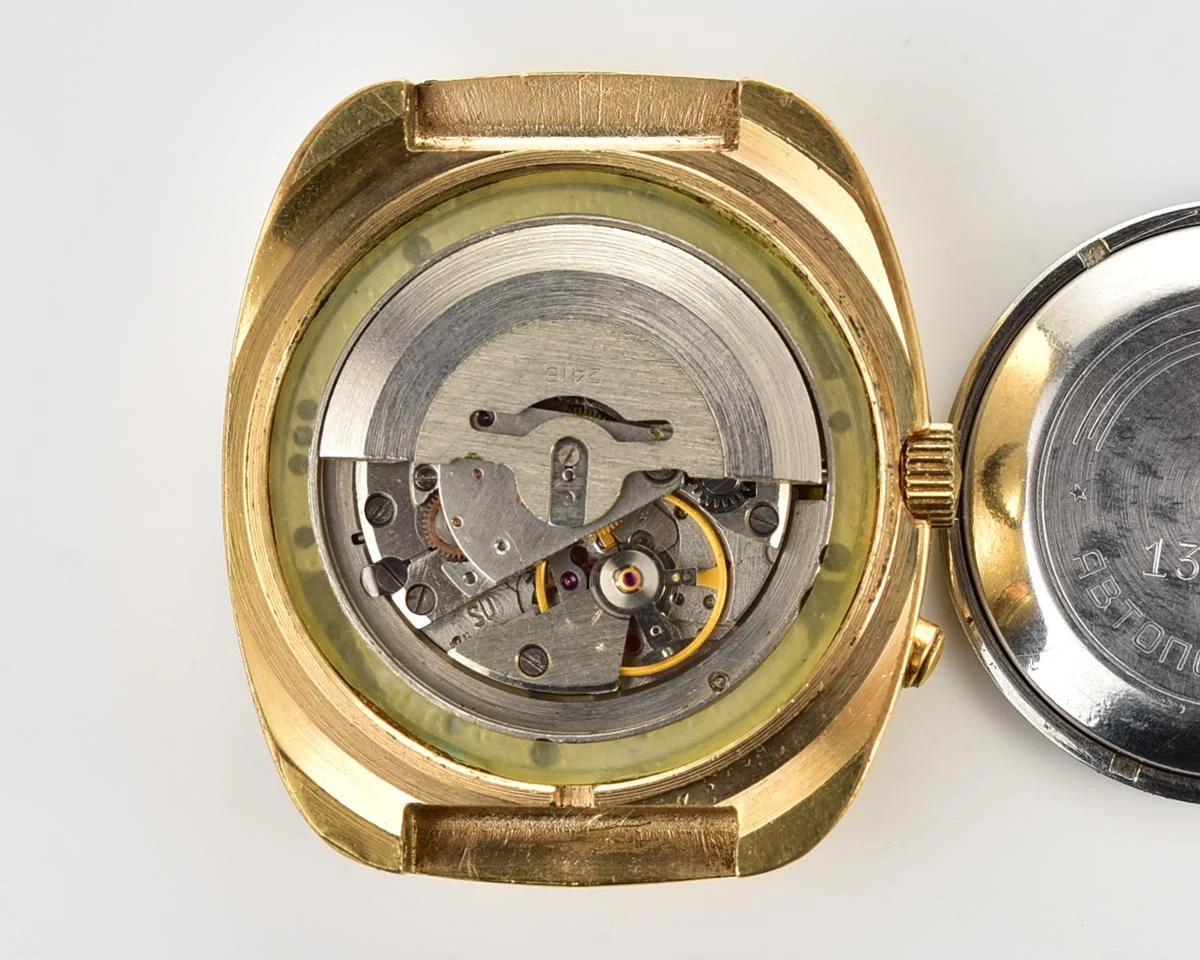 Slava vintage Soviet gold-plated mechanical watch with automatic self-winding movement
