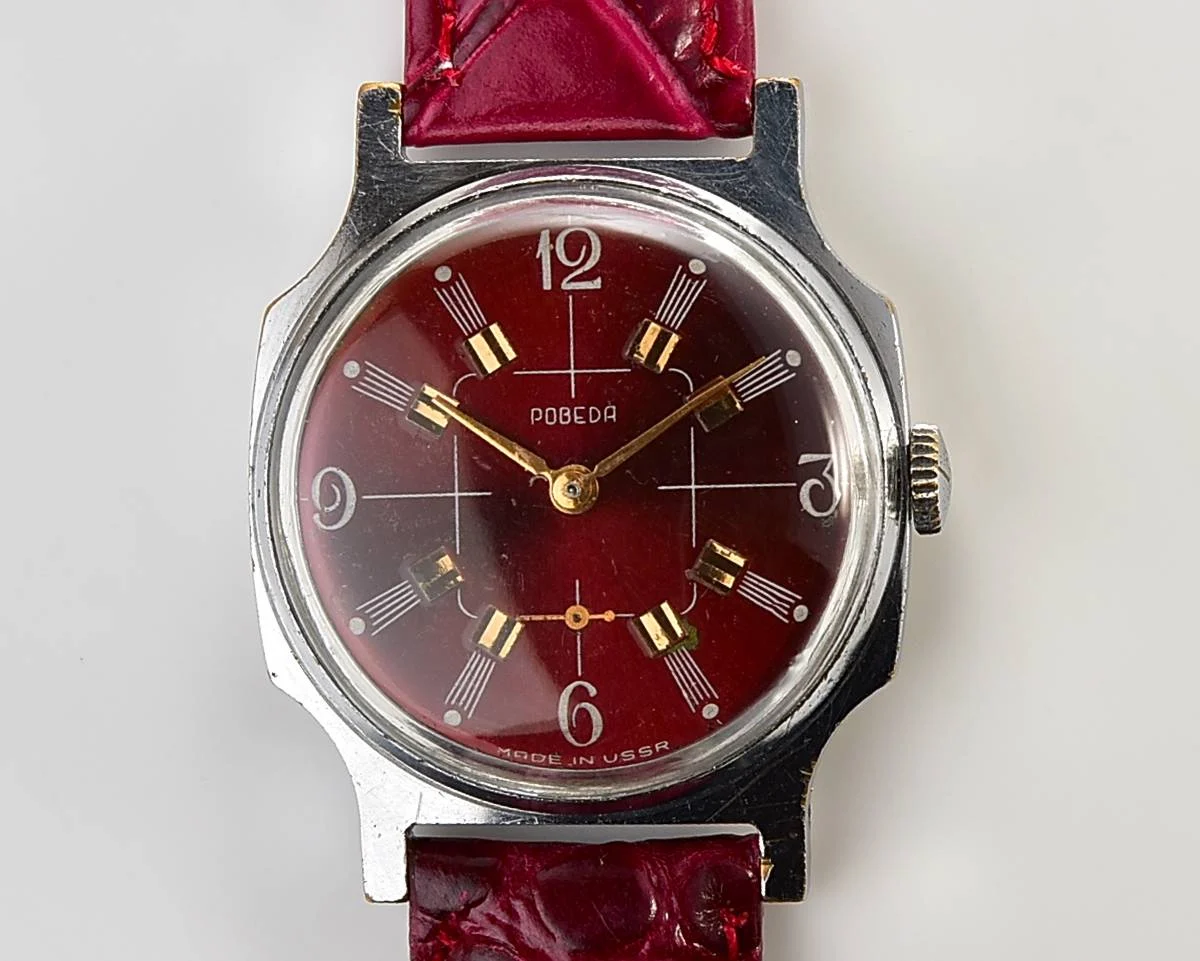 Pobeda Soviet mechanical wrist watch with crimson dial