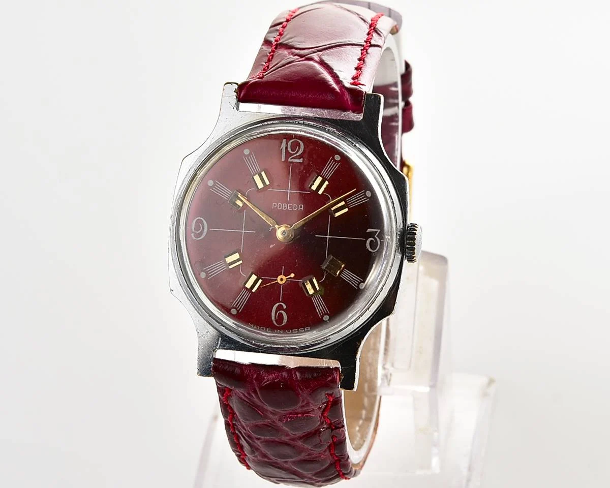 Pobeda Soviet mechanical wrist watch with crimson dial