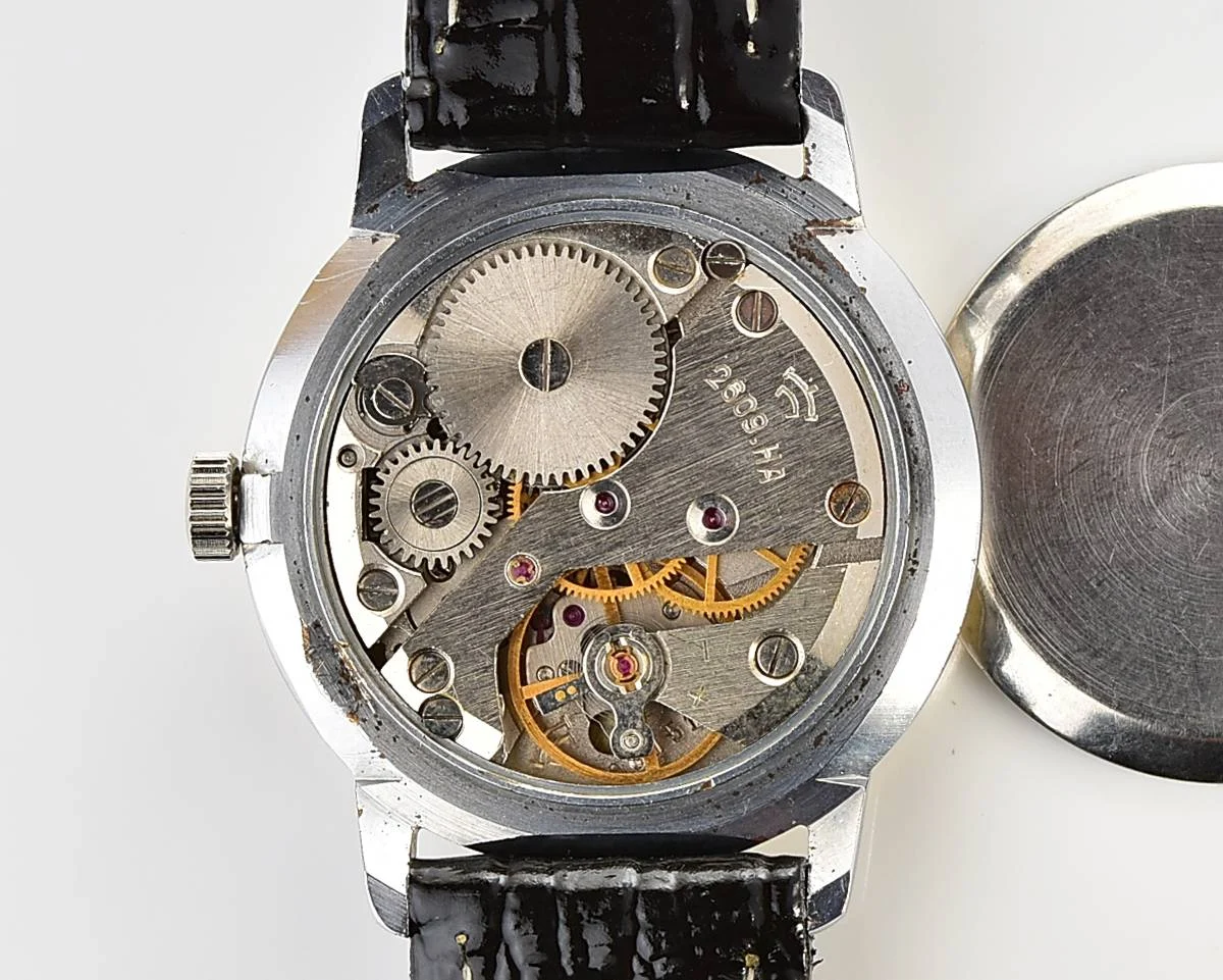 Vintage Soviet Raketa mechanical watch with intricate dial