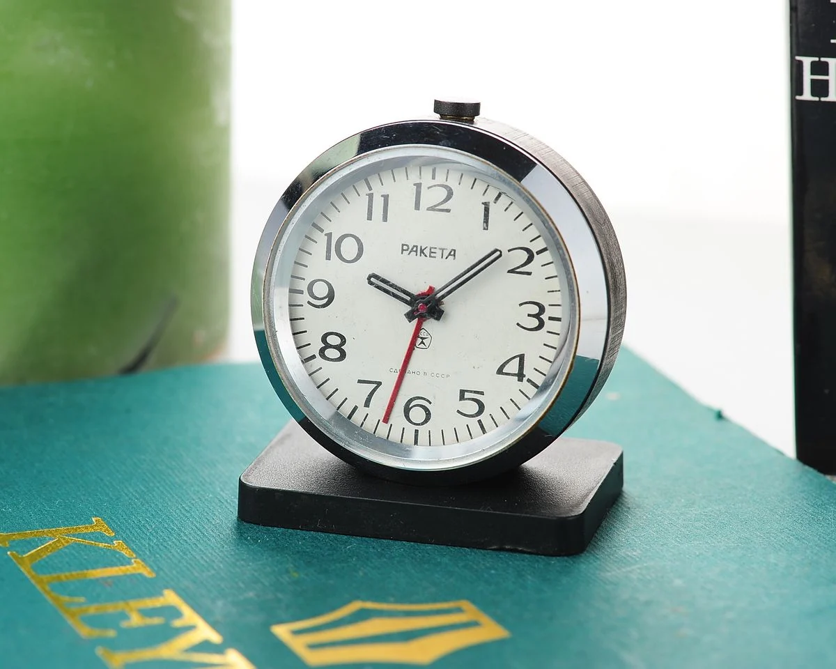Small Raketa Soviet mechanical alarm clock - less then 2 inches in diameter