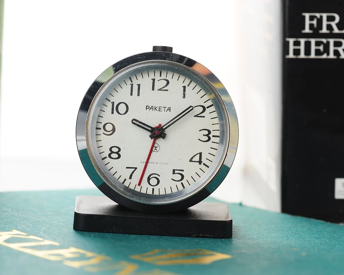 Small Raketa Soviet mechanical alarm clock - less then 2 inches in diameter