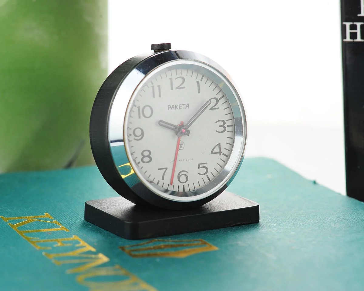 Small Raketa Soviet mechanical alarm clock - less then 2 inches in diameter