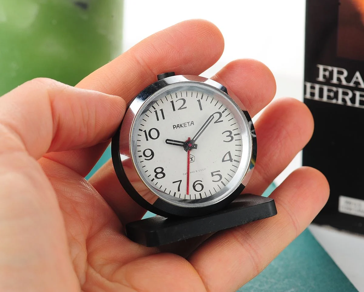 Small Raketa Soviet mechanical alarm clock - less then 2 inches in diameter
