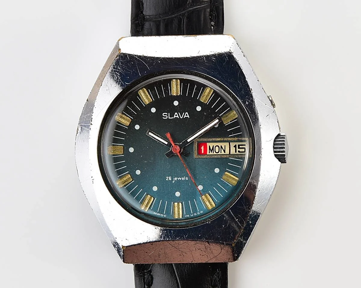 Slava Soviet mechanical vintage watch with teal dial
