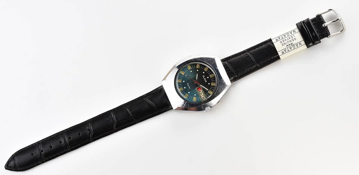 Slava Soviet mechanical vintage watch with teal dial