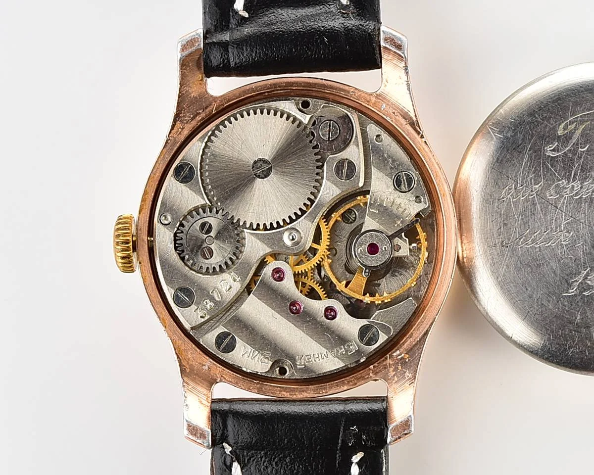 Vintage Soviet ZiM mechanical watch with engraved back