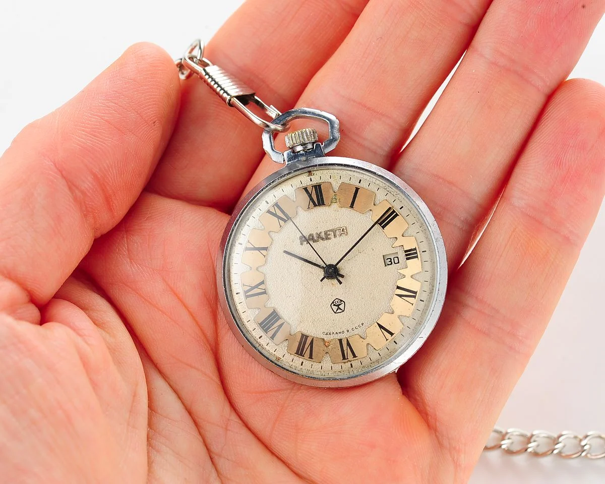 Mechanical Raketa Soviet pocket watch with calendar