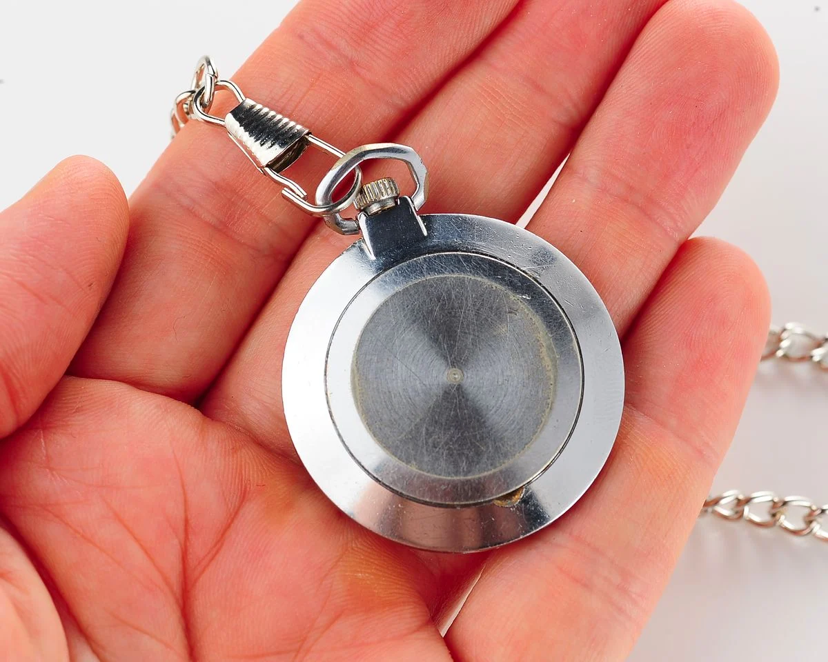 Mechanical Raketa Soviet pocket watch with calendar