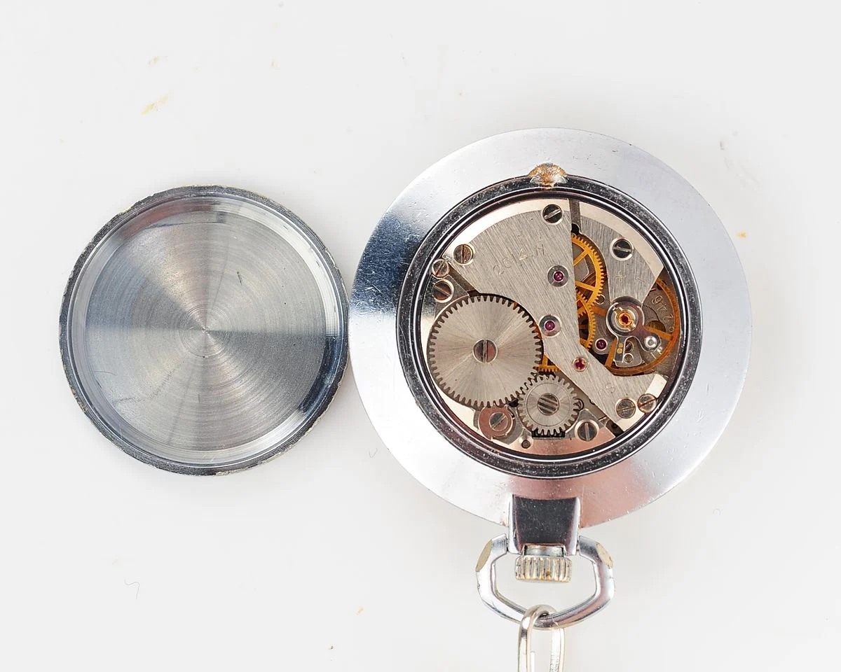 Mechanical Raketa Soviet pocket watch with calendar