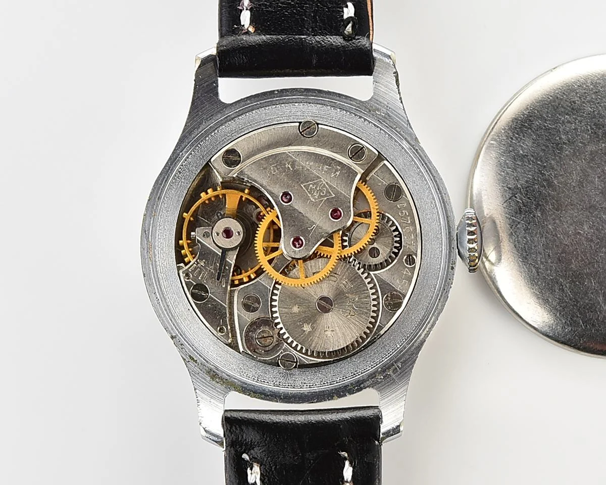 Excellent vintage Pobeda watch with central seconds hand and diamond shaped crown!