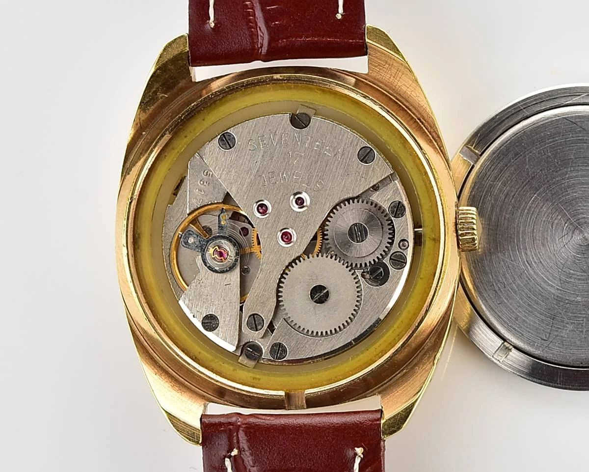 Soviet Poljot mechanical gold-plated wrist watch with intricate textured dial