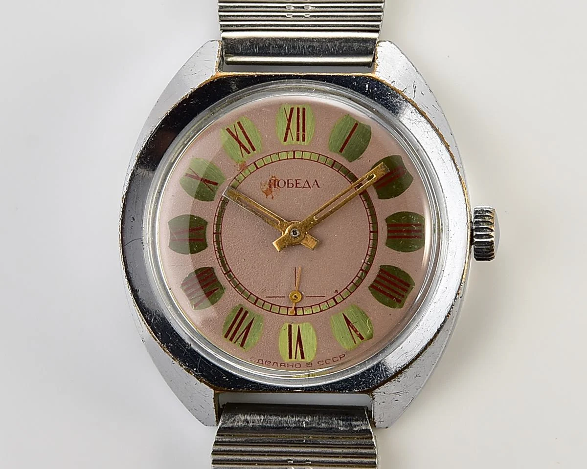 Soviet Pobeda mechanical wristwatch with Raketa stainless steel bracelet