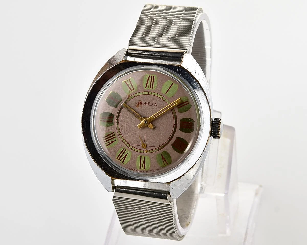 Soviet Pobeda mechanical wristwatch with Raketa stainless steel bracelet