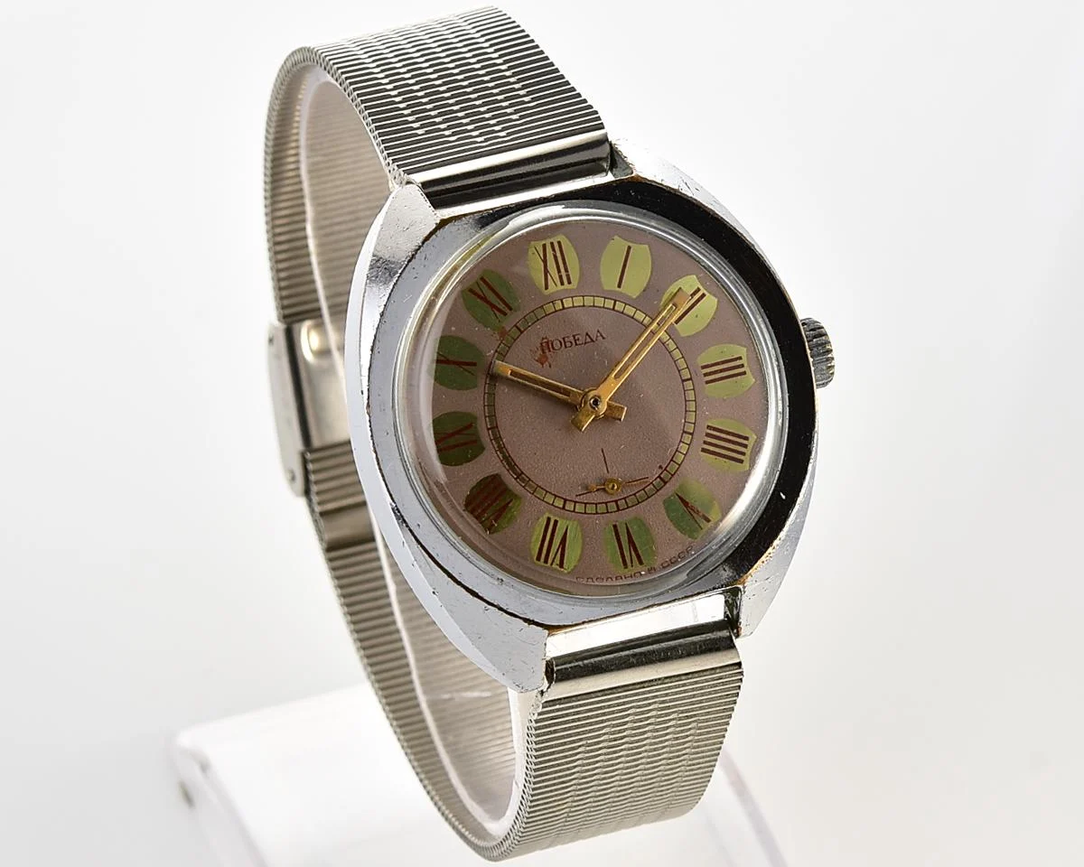 Soviet Pobeda mechanical wristwatch with Raketa stainless steel bracelet