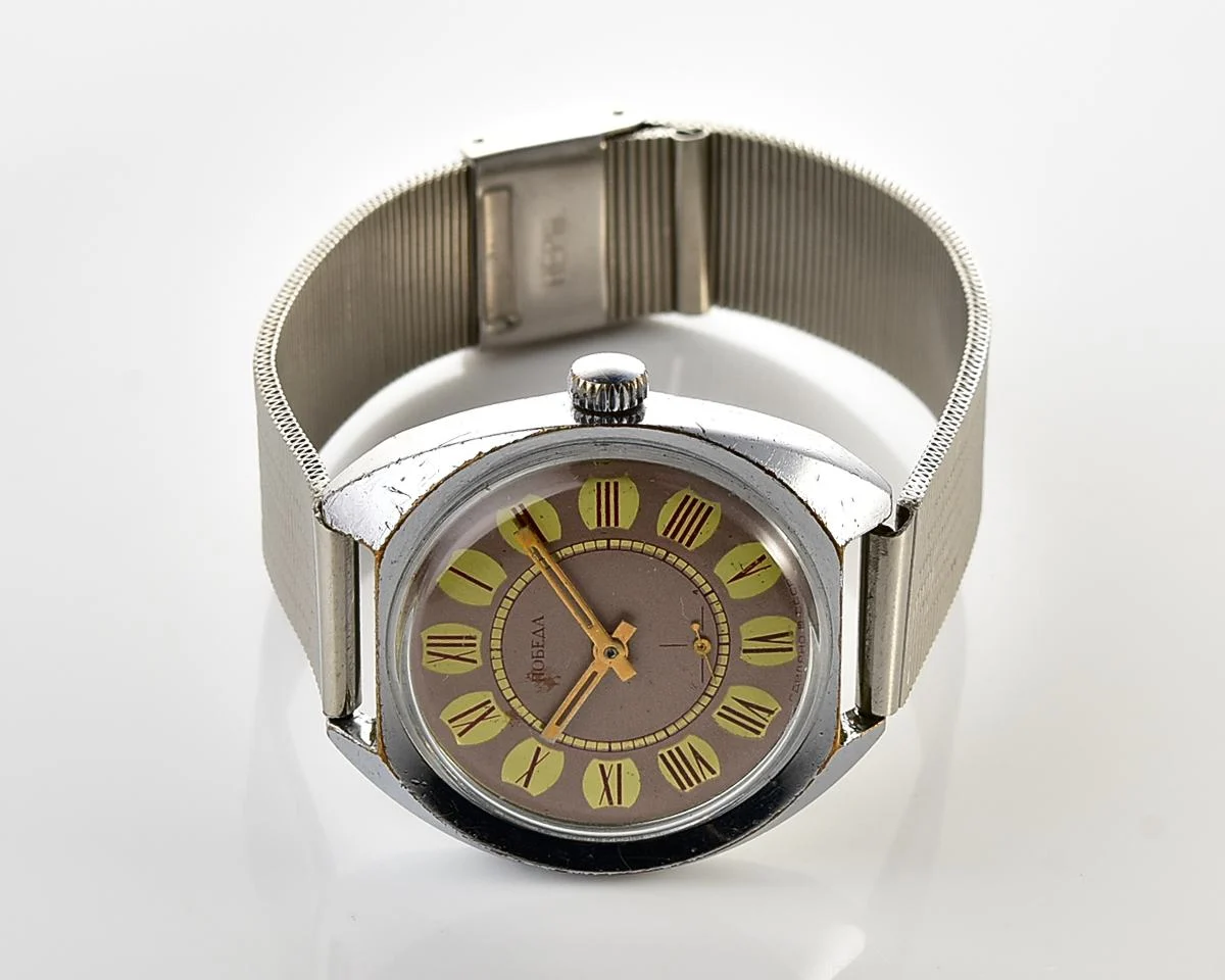 Soviet Pobeda mechanical wristwatch with Raketa stainless steel bracelet
