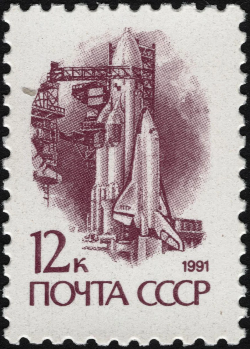The_Soviet_Union_1991_CPA_6300_stamp_(14th_standard_issue_of_Soviet_Union._3rd_issue._Space_Exploration._'Energia'_rocket_and_'Buran'_spacecraft_on_launch_pad)_1200dpi
