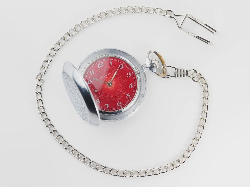 Mechanical Molnija Soviet pocket watch with red dial