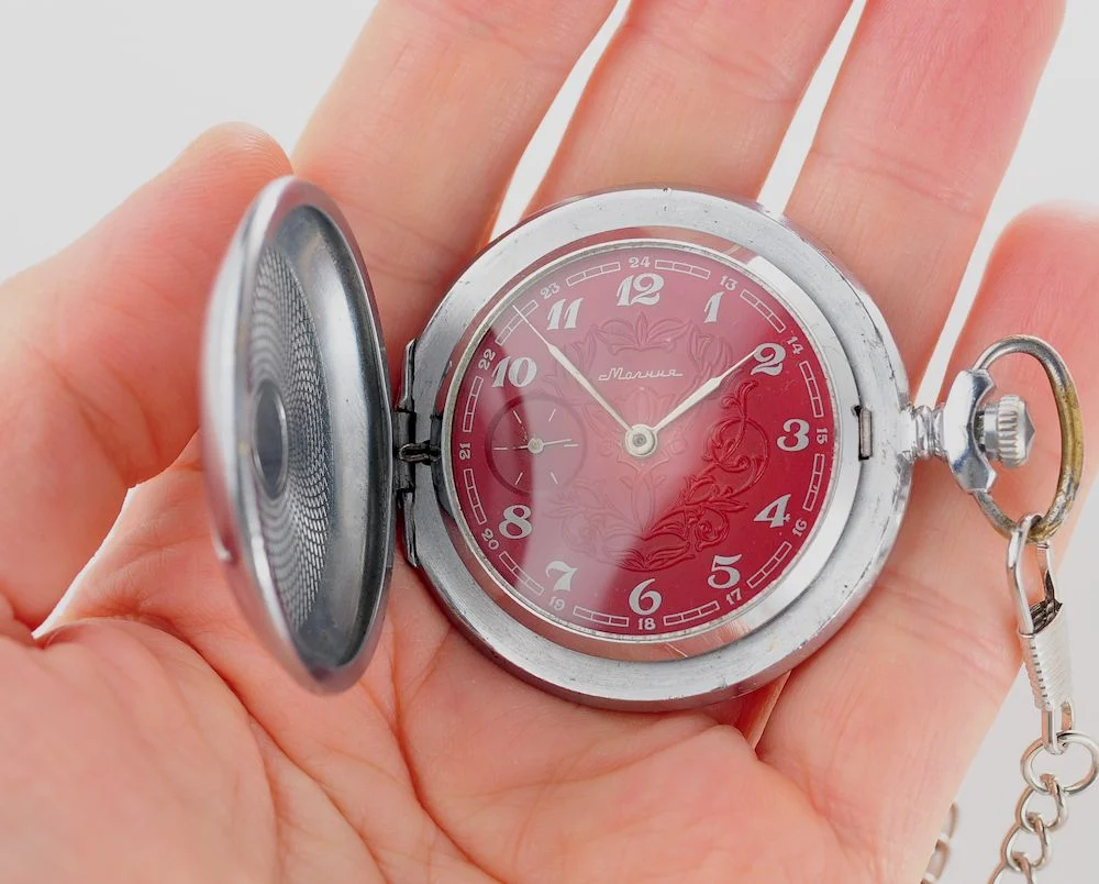 Mechanical Molnija Soviet pocket watch with red dial