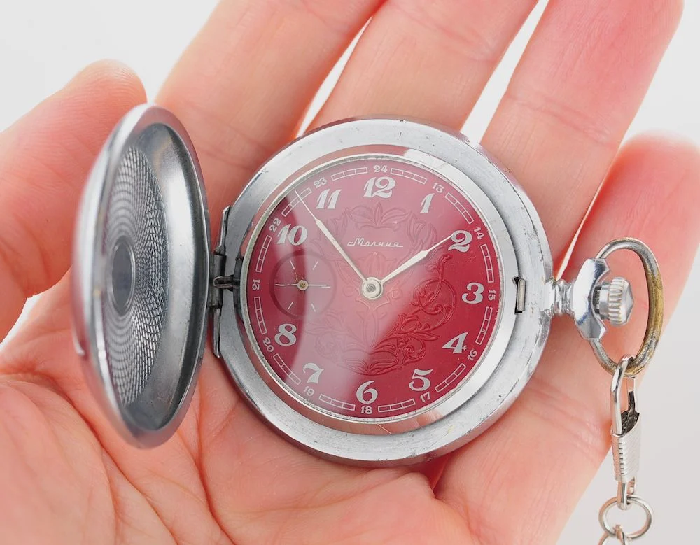 Mechanical Molnija Soviet pocket watch with red dial