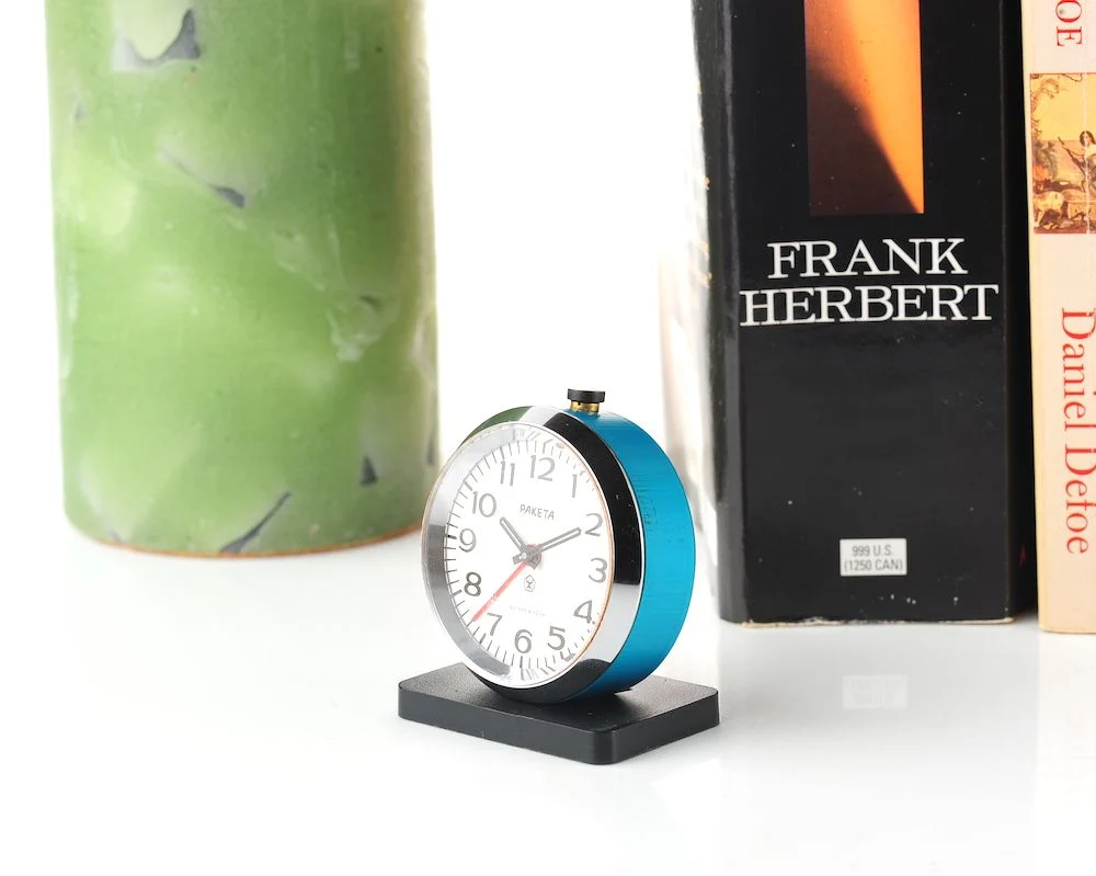 Small Raketa Soviet mechanical alarm clock - less than 2 inches in diameter