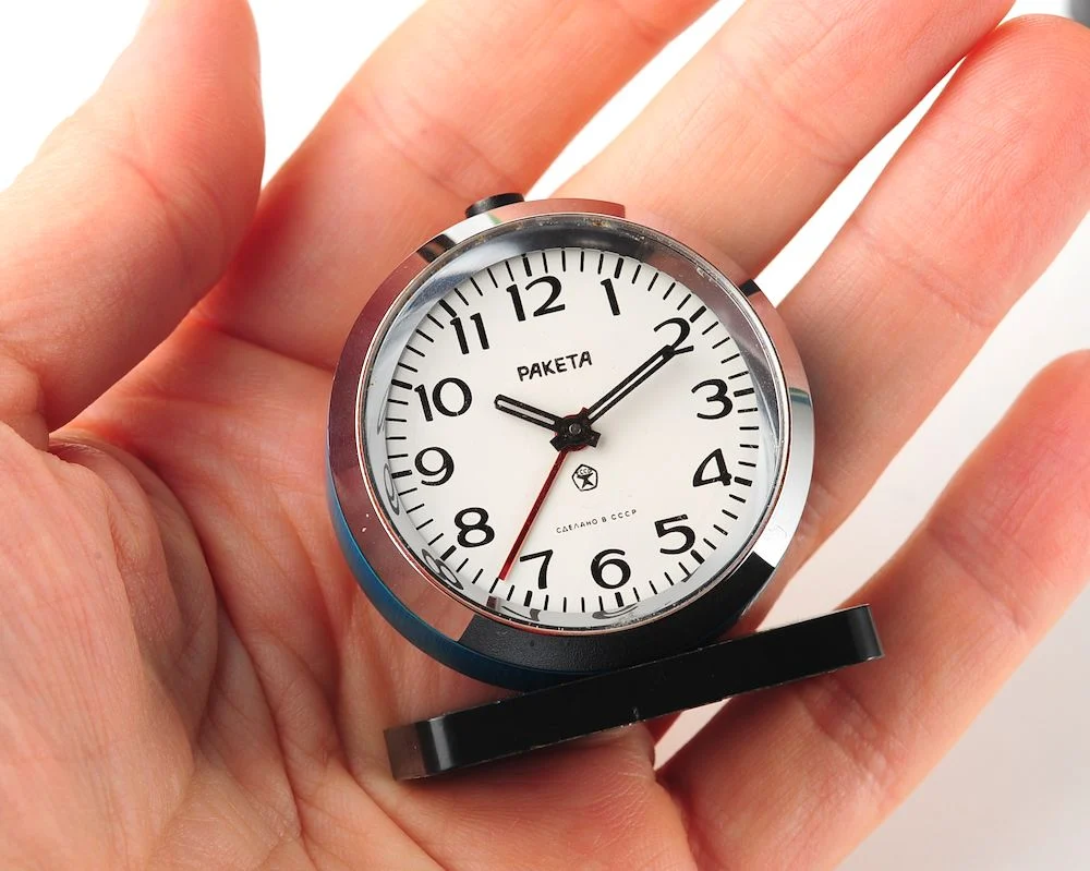 Small Raketa Soviet mechanical alarm clock - less than 2 inches in diameter