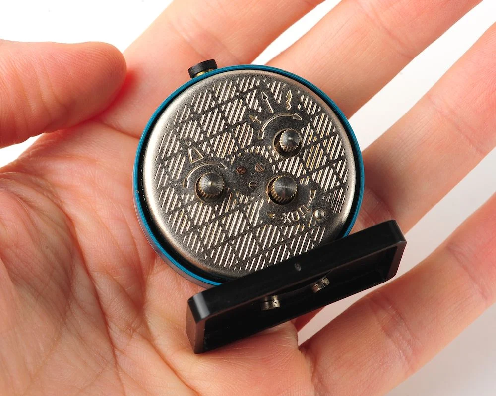 Small Raketa Soviet mechanical alarm clock - less than 2 inches in diameter
