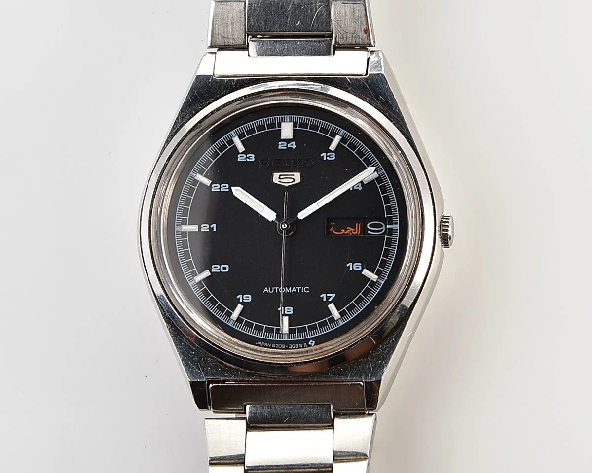 Vintage 1985 Seiko 5 Automatic with Military-Style Black Dial with English/Arabic Day-Date